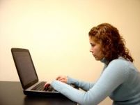 Woman On A Computer Applying For A Tutoring Job